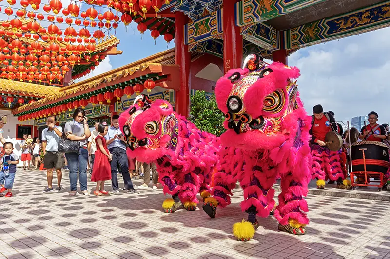 Traditional lion dance performance during Chinese New Year celebrations at Thean Hou Temple in Kuala Lumpur, Malaysia.