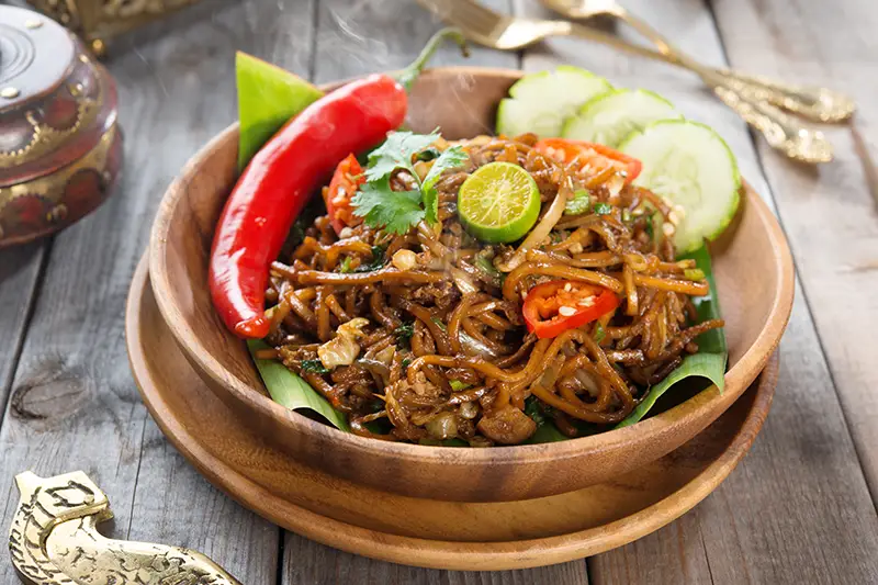 A plate of Mee Goreng Mamak, a flavorful Malaysian dish, a must-try for food lovers exploring the top things to do in Kuala Lumpur